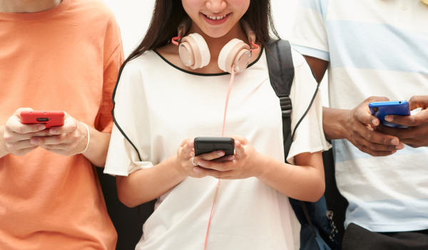 Students looking down at their phones