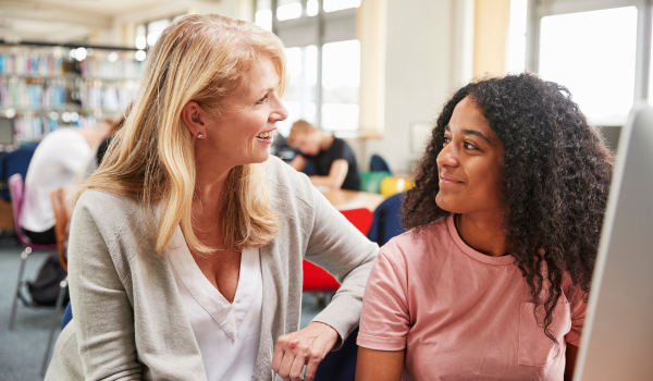 a student talking to a teacher